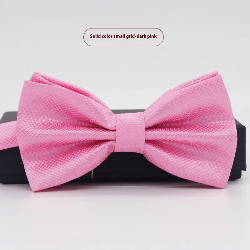 Men's flat head style polyester bow tie in a solid colour, shown with adjustable neck strap.