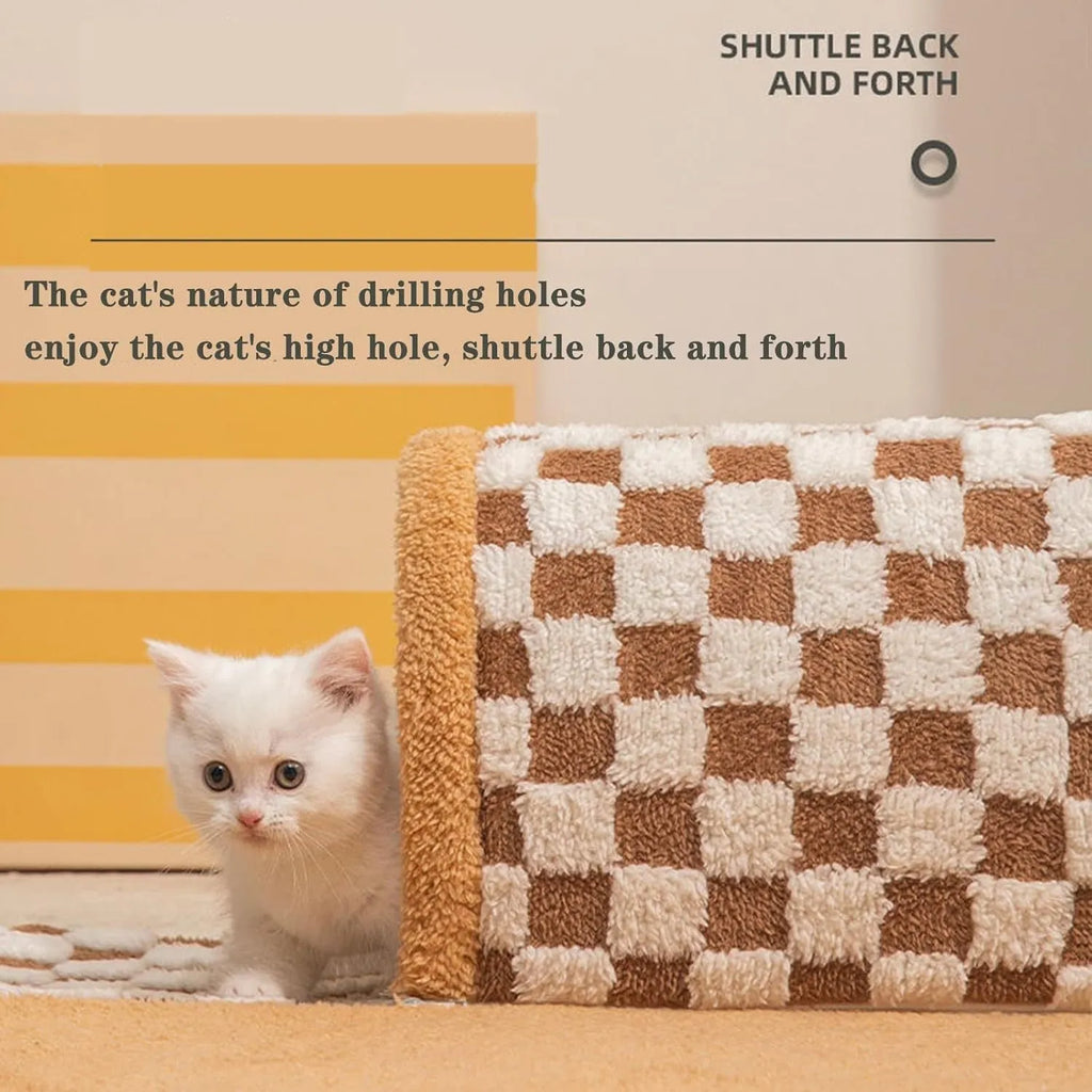 Brown plaid collapsible cat tunnel bed with a central mat on a wooden floor.