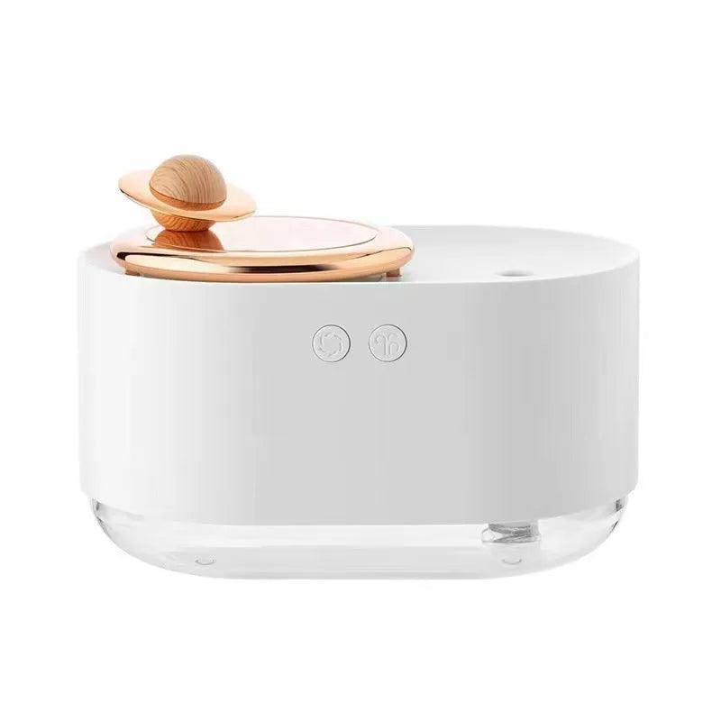 Green rotating planet USB portable humidifier with night light on a wooden desk.