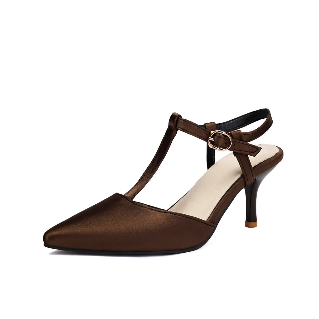 Women's pointed T-strap high heels in top grain leather, black colour, side view on plain background