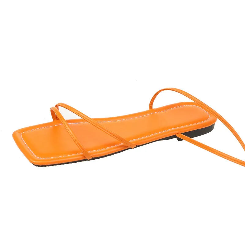 Women's flat sandals with ankle ring bandage strap and square toe in white, black, or orange red.
