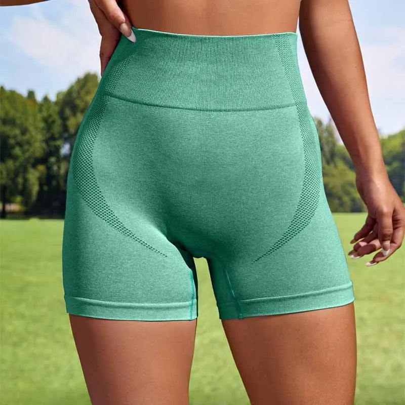 Women's seamless high-waist sport leggings shorts in army green, shown laid flat.