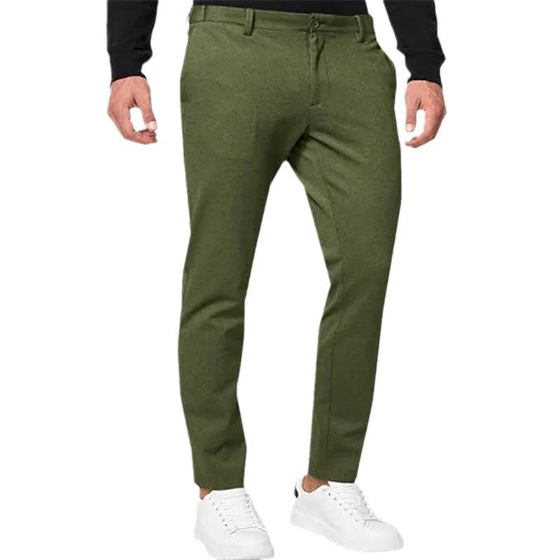 Men's slim-fit tapered chino pants in Army Green colour, showing pleated front and zipper fly detail.