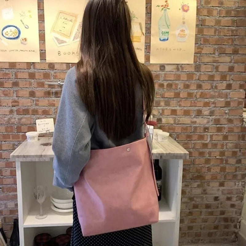 Corduroy tote bag with one-shoulder strap in pink colour showing structured dimensions and PU-lined interior