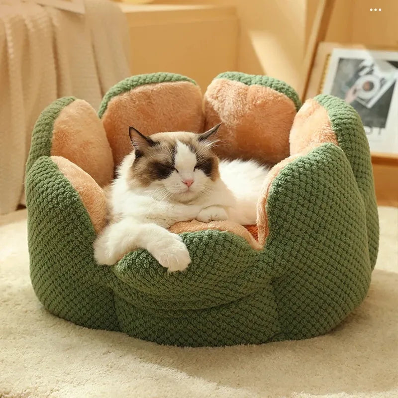 Green cactus petal shape plush kennel bed for cats and small dogs on a hardwood floor.