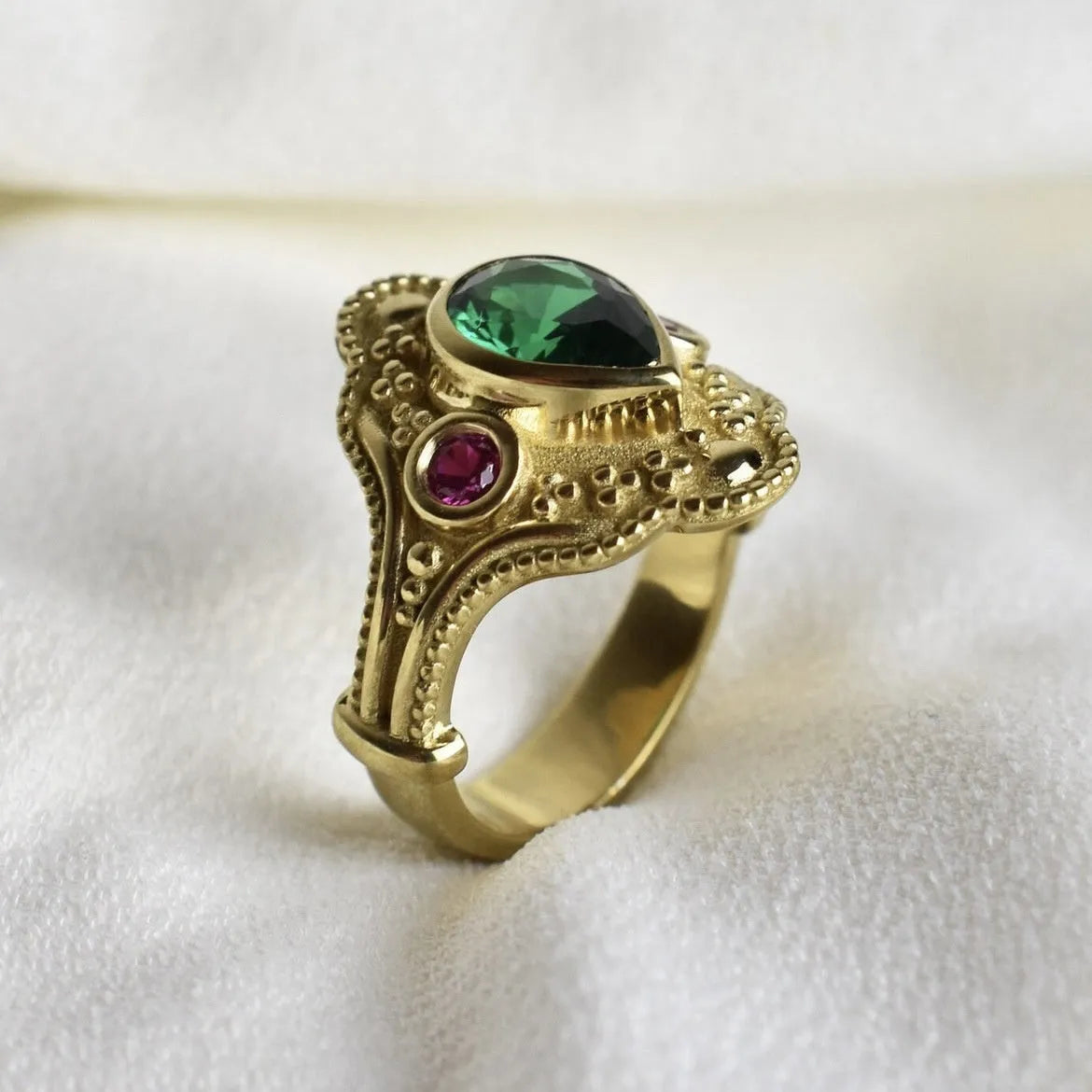 Gold-plated geometric ins style women's ring in golden lvzuan colour on a white background.