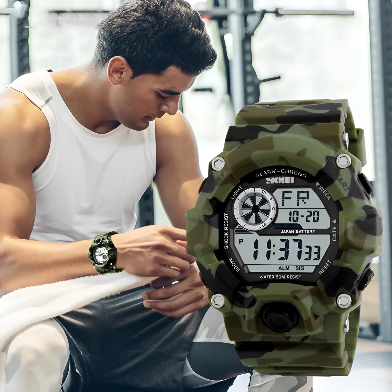 Digital sports watch with round dial, plastic strap, and display showing time, date, and dual time zones.