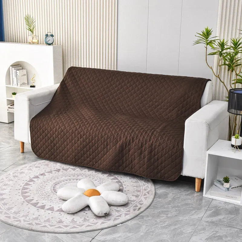 Reversible dog blanket sofa cover in burgundy colour protecting a leather couch from pet damage