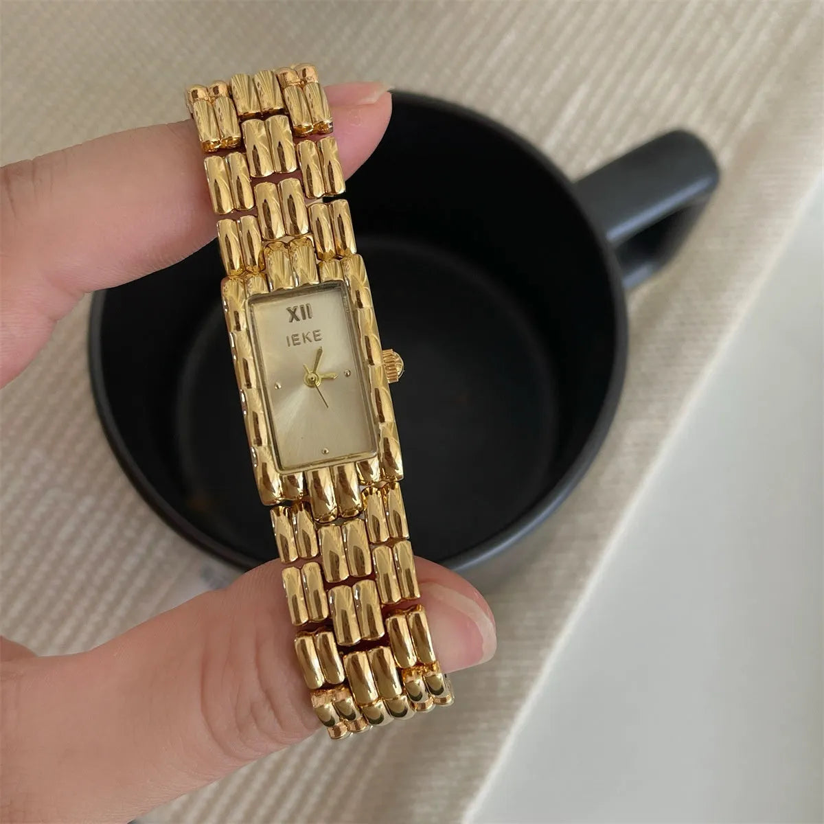Women's stainless steel bracelet watch with 15mm dial and butterfly buckle