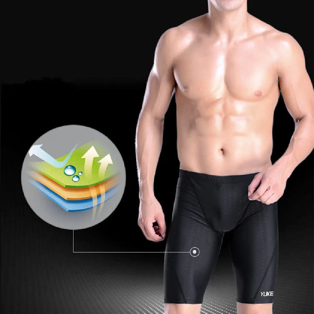 Men's black swimming set including briefs, anti-fog goggles, waterproof cap, ear plug nose clip, and carrying bag