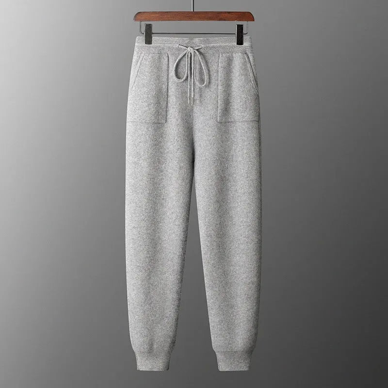 Men's light gray hooded cashmere sweatshirt and matching trousers laid flat as a set.
