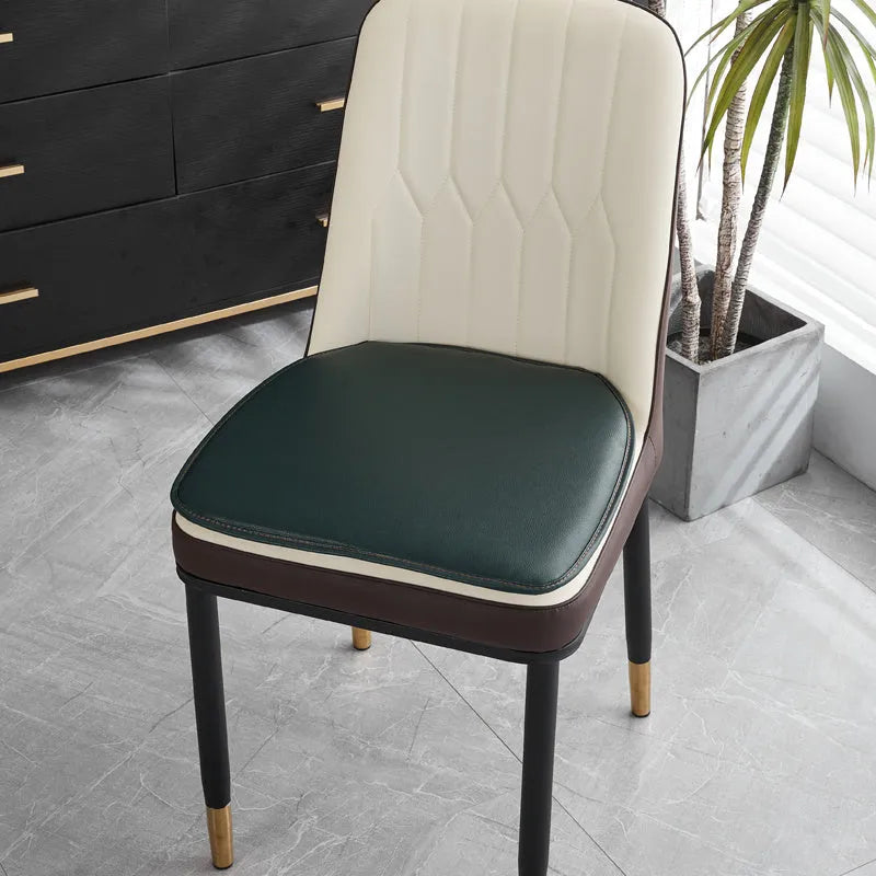 Beige leather horseshoe-shaped seat cushion with anti-slip base on a wooden chair