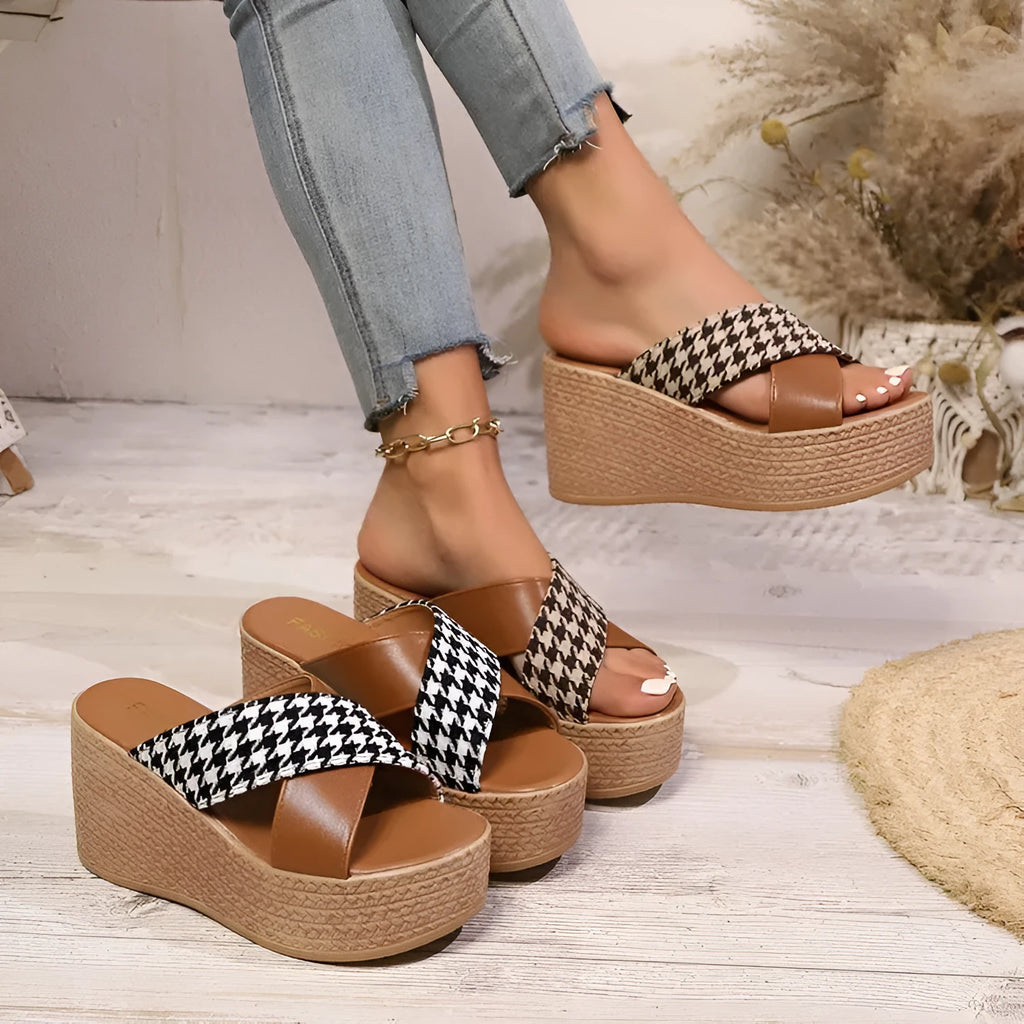 Cross leopard plaid pattern wedge sandals with a brown and black design and a rubber sole.