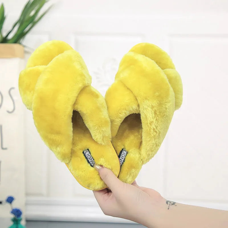 Cross open-toe fur slippers in multiple colours on a patterned non-slip sole.