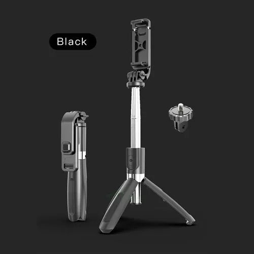 Black and white adjustable Bluetooth selfie stick tripod with wireless remote control extended next to smartphone.