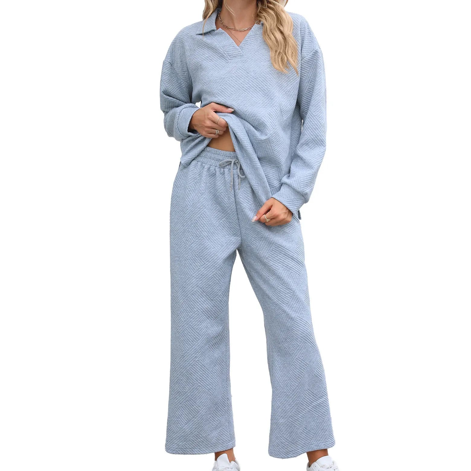 Women's black geometric pattern knitted jacquard long sleeve top and elastic waist cropped pants suit set.