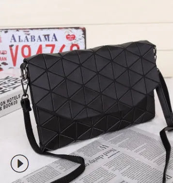 Rhombic ABS shoulder bag in envelope style, available in multiple colours including black and pink.