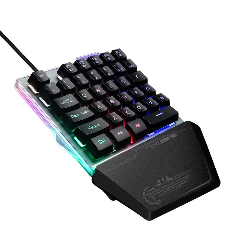 Black robotic one-handed G40 keyboard with RGB backlit keys on a desk.