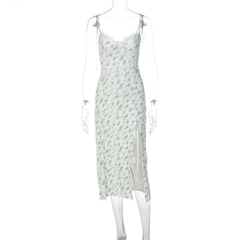 Women's blue lace flower print long dress with black suspender straps and a thigh-high side slit.