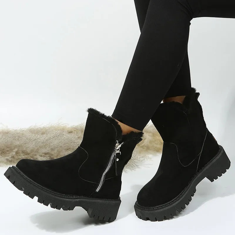 Women's black high-top snow boots with a side zipper and faux suede upper on a rubber sole.