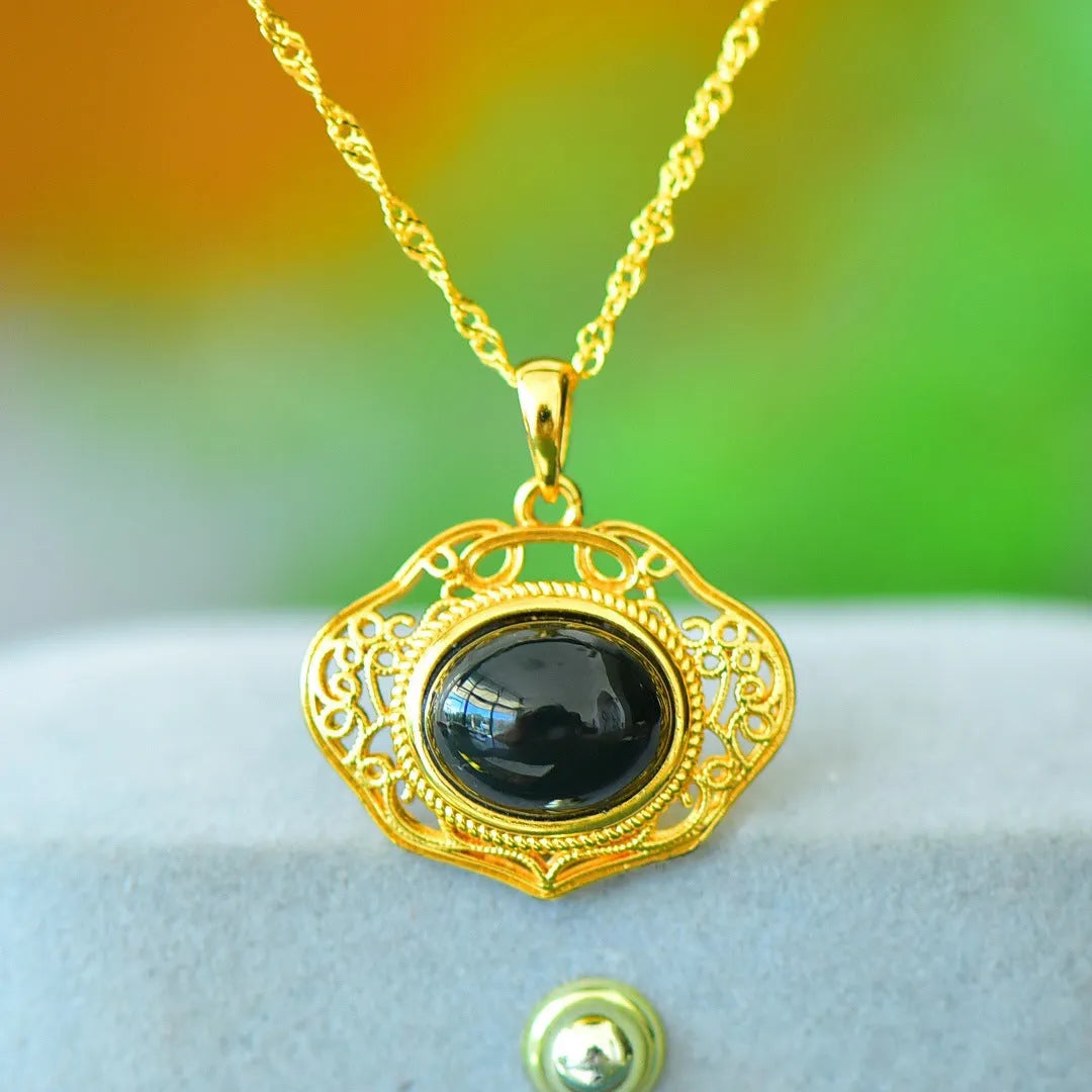 Flat grey Hetian Jade pendant with copper inlay and blue jadeware detail on a silver chain.