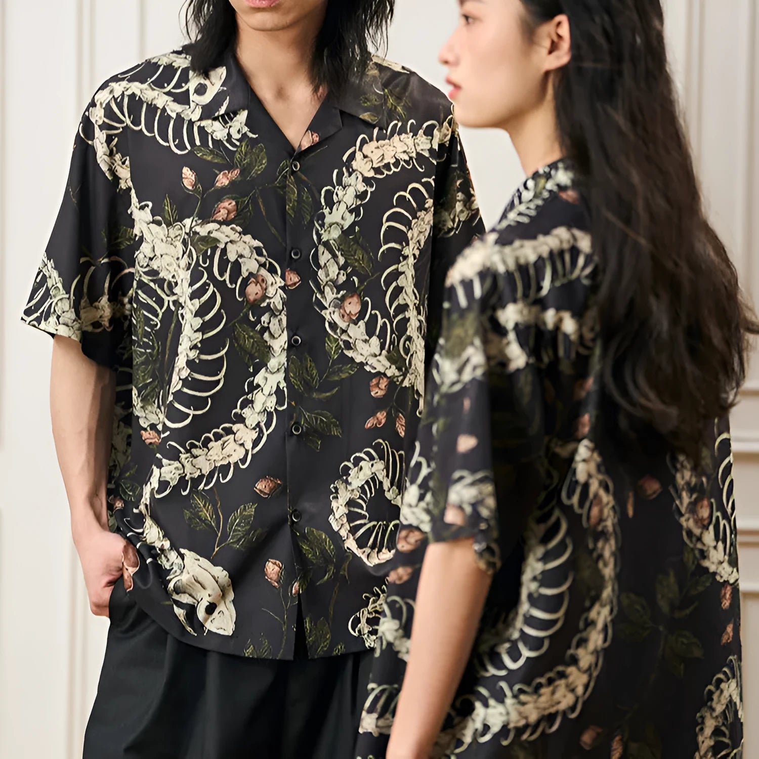Short sleeve loose-fit shirt with a Cuban collar and a printed snake bone floral pattern.