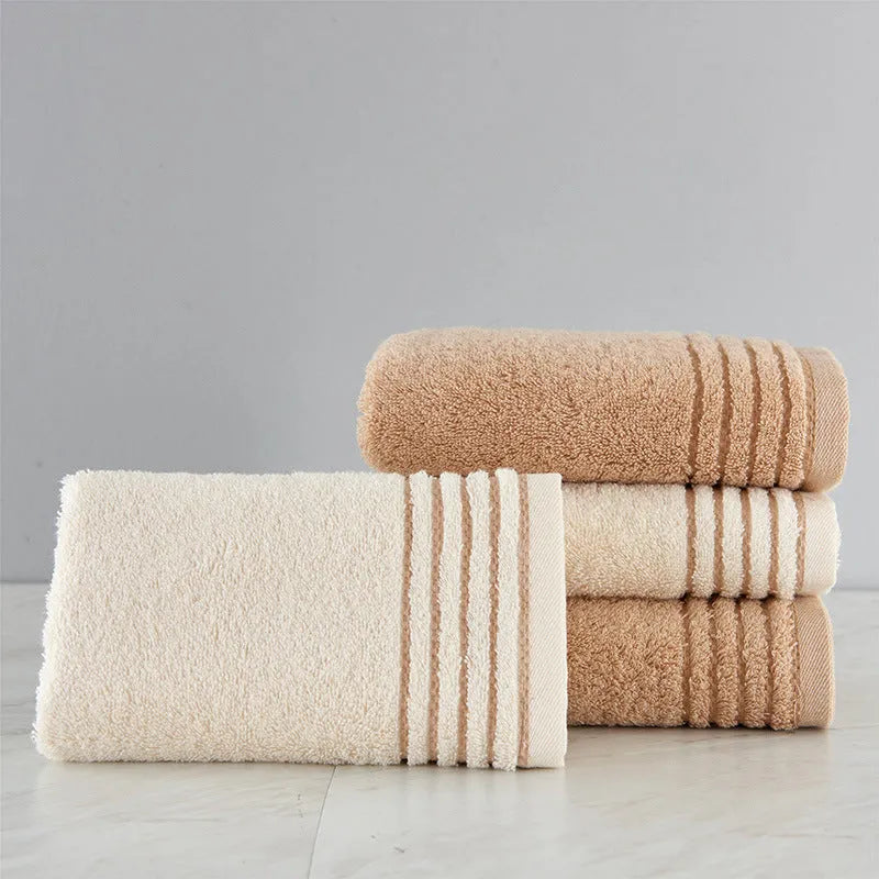 Cotton towel set in beige and brown with 395 GSM weight including bath towel, hand towel, and face cloth