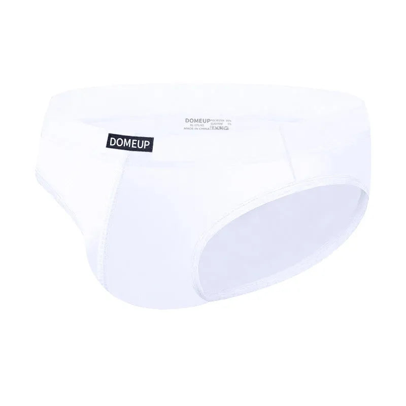Men's seamless low-waist briefs in black, white, and pink solid colours