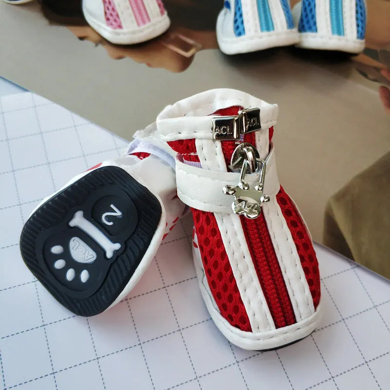 Blue zipper dog shoes with non-slip sole from a four-pair pet sneaker set.