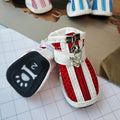 Blue zipper dog shoes with non-slip sole from a four-pair pet sneaker set.