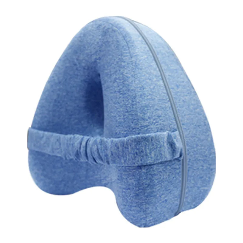 Heart-shaped dark blue memory foam leg pillow for adult knee or ankle support.