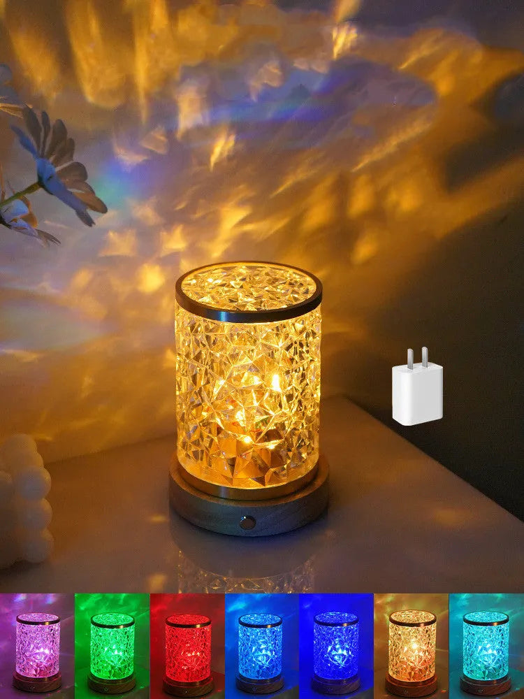 Rotating water ripple night light with acrylic dome on a solid wood base.