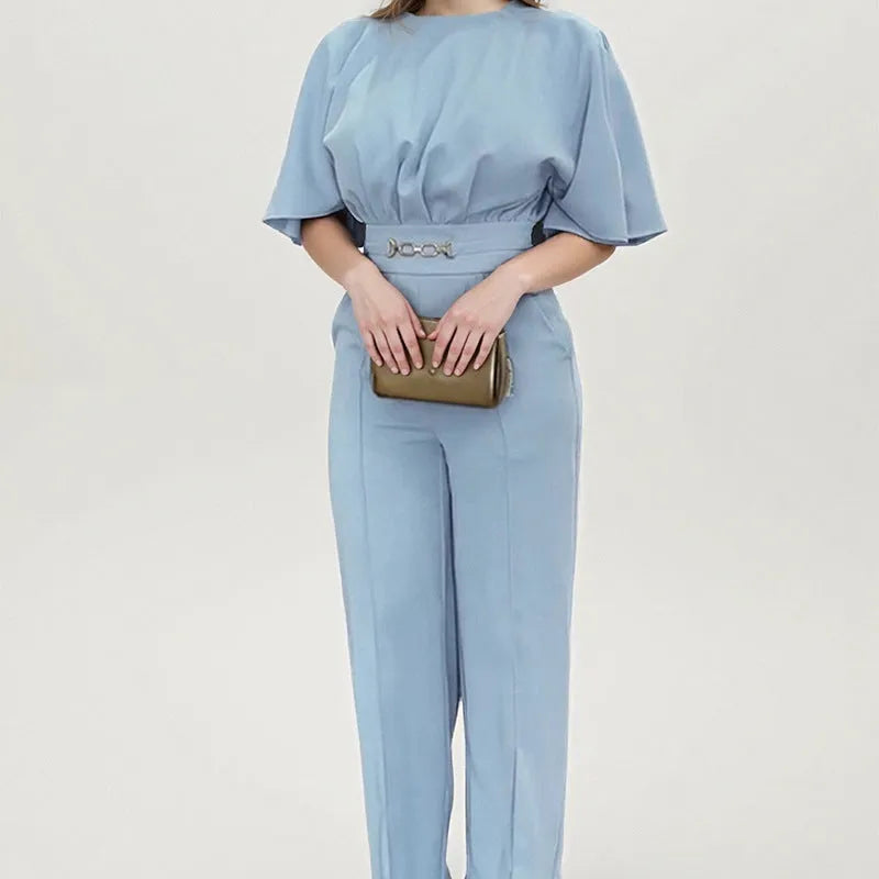 Blue polyester men's two-piece suit with long-sleeved jacket and trousers on hanger