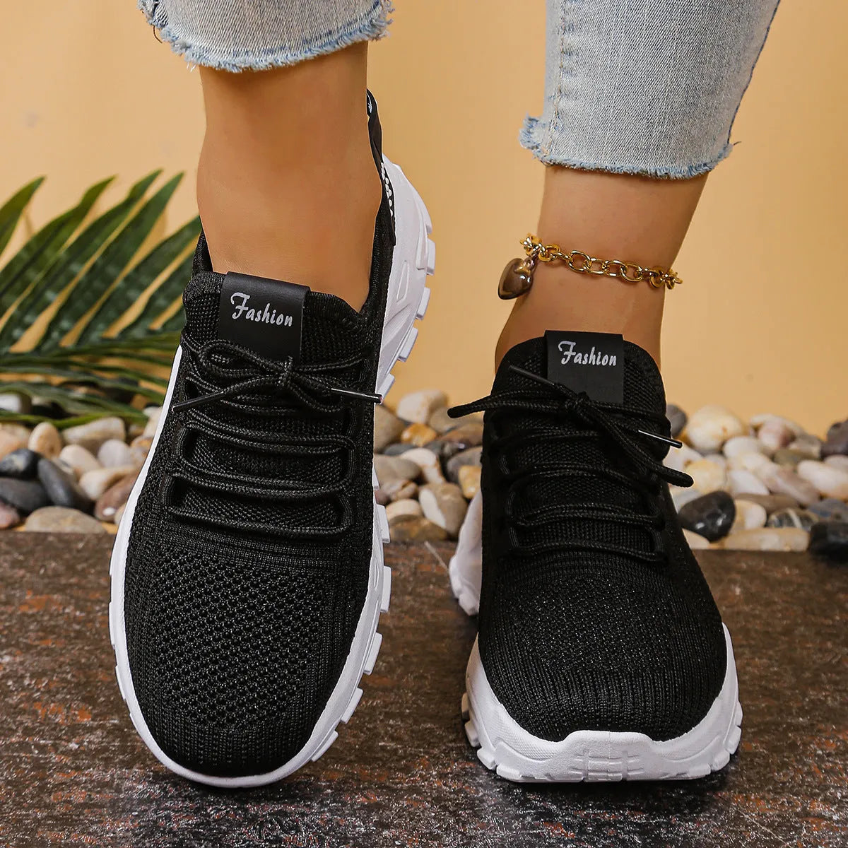 Women's low-top mesh sports shoes with a platform sole and round toe in a solid colour.
