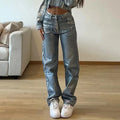 Women's high waist straight leg jeans in washed blue denim with silver contrast details