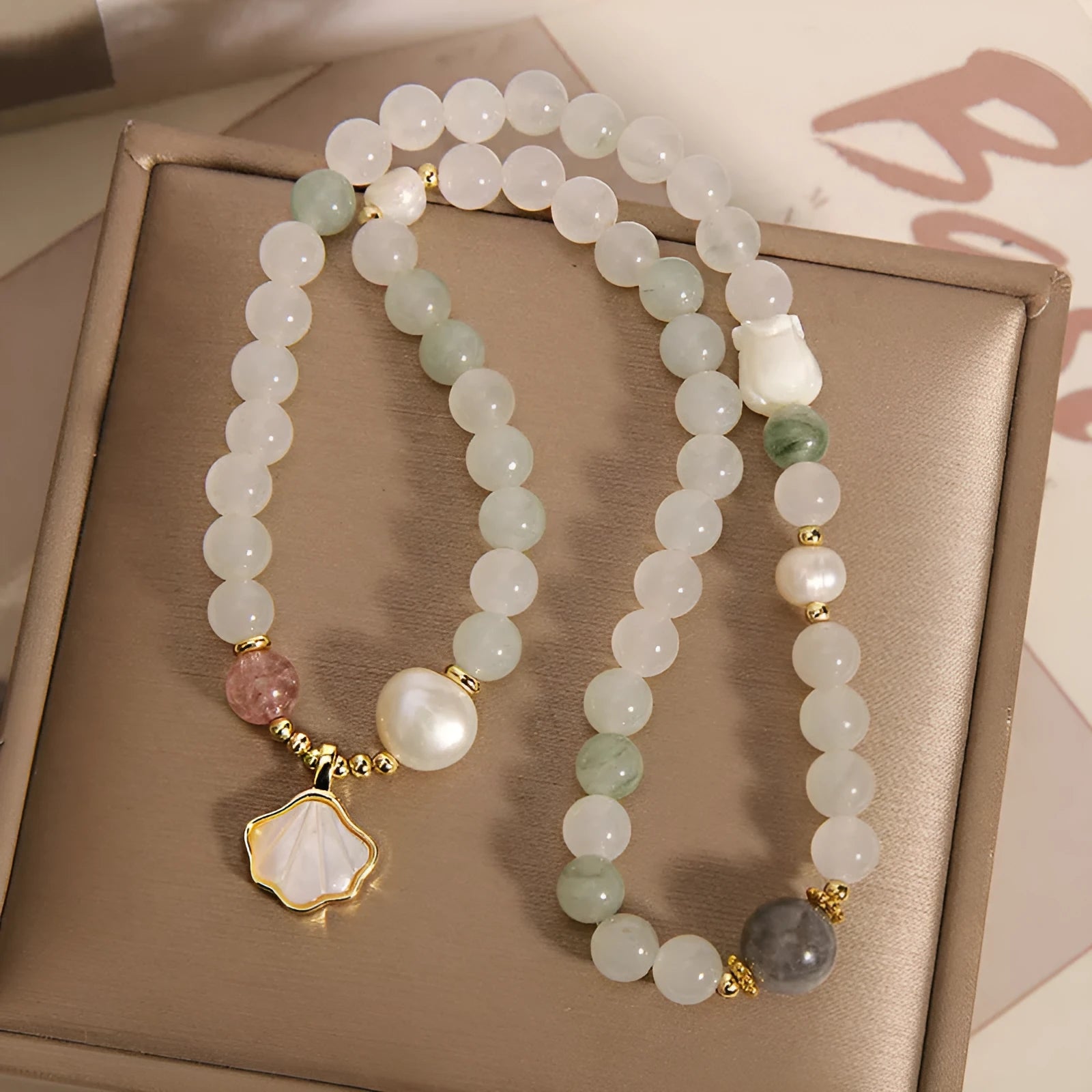 Tianshan emerald green crystal bracelet with gold-plated apricot leaf pendant and rhinestone details