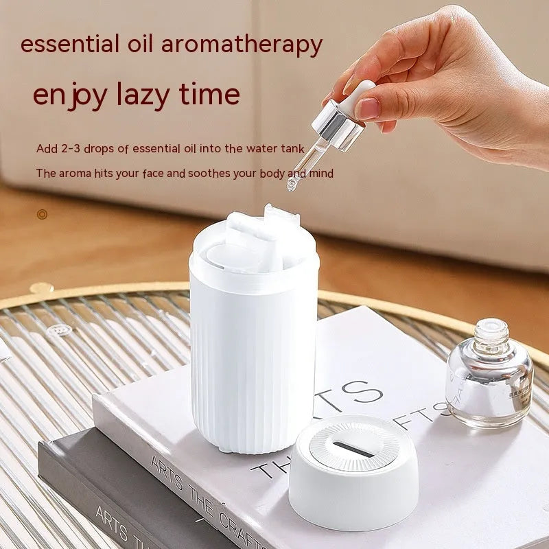 Car flame design aroma diffuser with automatic sprayer in black or white, measuring 70x70x143mm