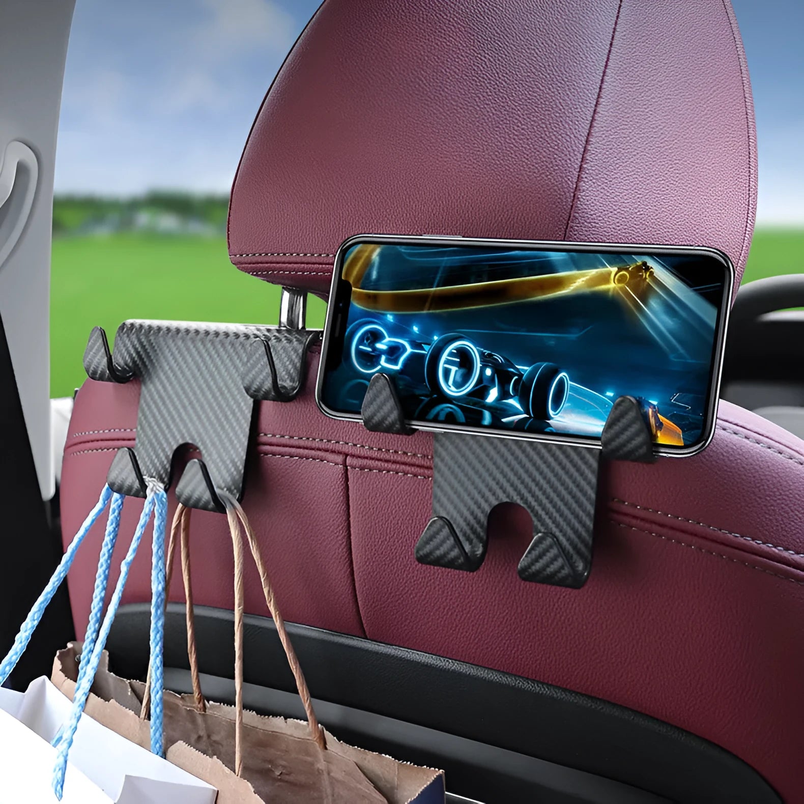 Black ABS plastic car hook with integrated mobile phone holder bracket for rear seat backs.