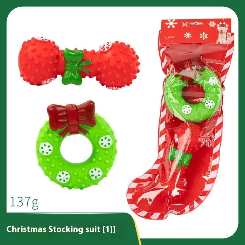 Christmas vinyl dog toy set with Santa Claus heads, trees, tennis balls, and bite ropes
