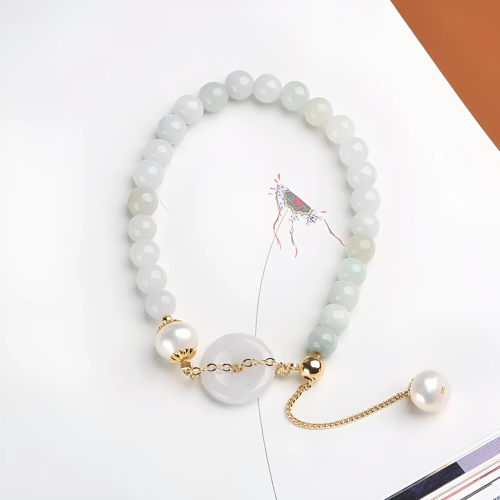 Women's jade pearl bracelet with natural emerald peace buckle and geometric national style design