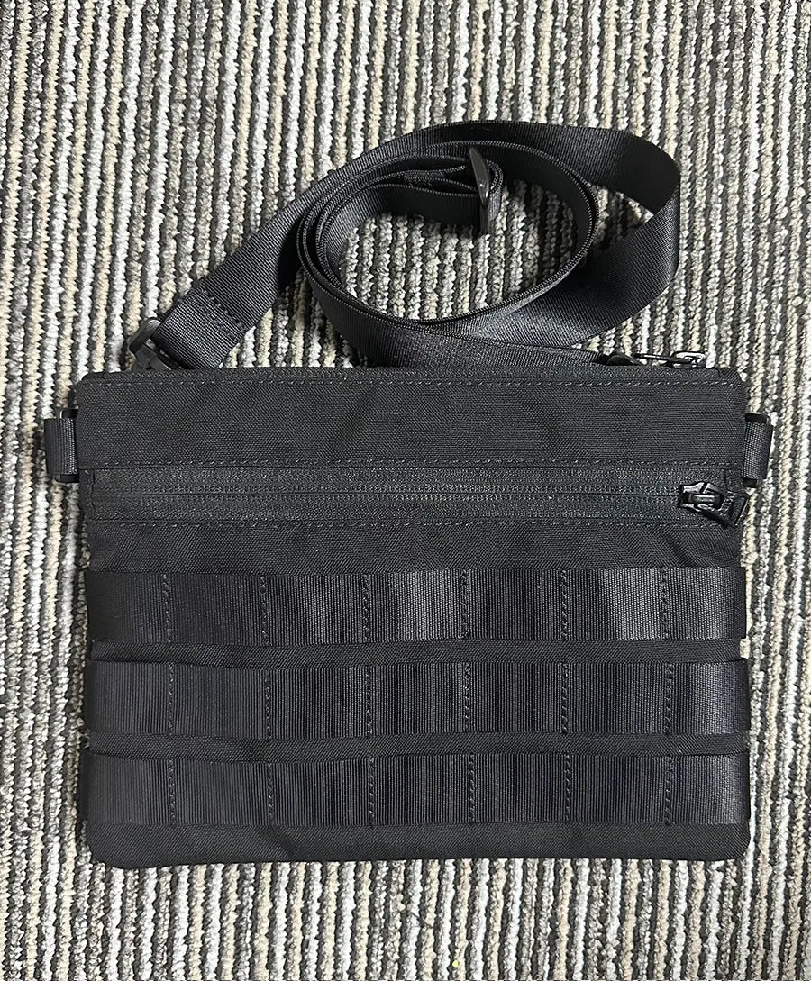 Black Oxford cloth tactical outdoor pouch measuring 18 by 3.5 centimetres
