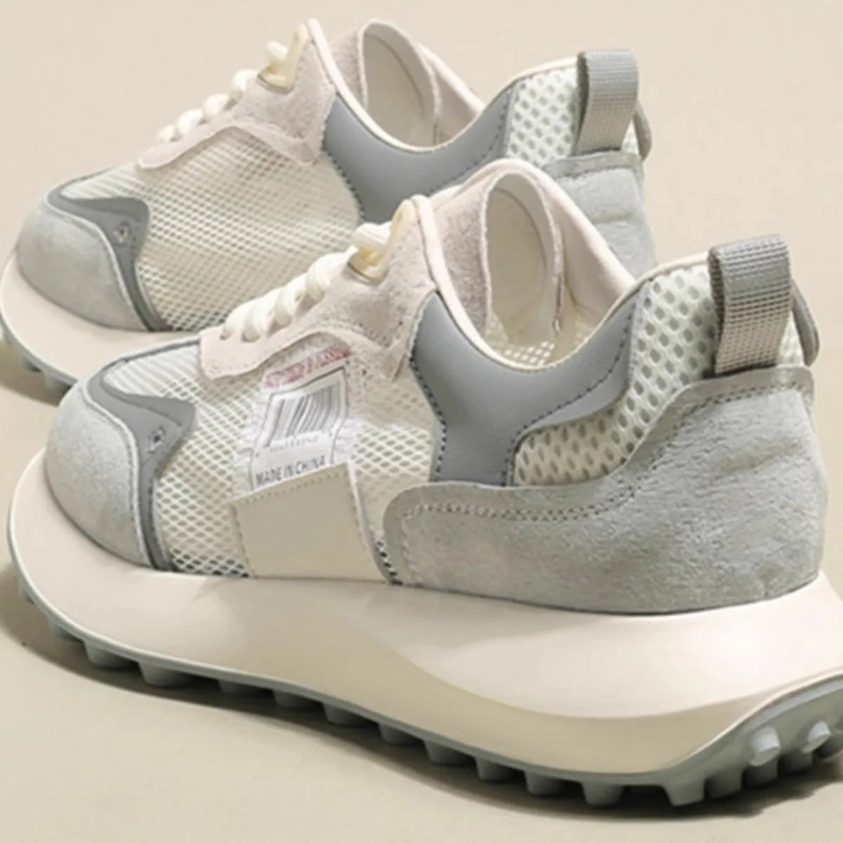 Women's grey and pink retro sneakers with mesh lining and rubber sole in low-top design