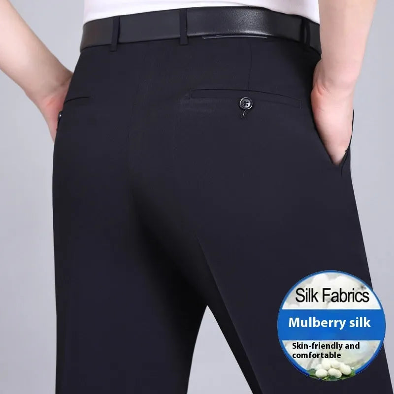 Man wearing dark blue straight-leg suit pants with a high waist, made from a non-ironing mulberry silk blend fabric.