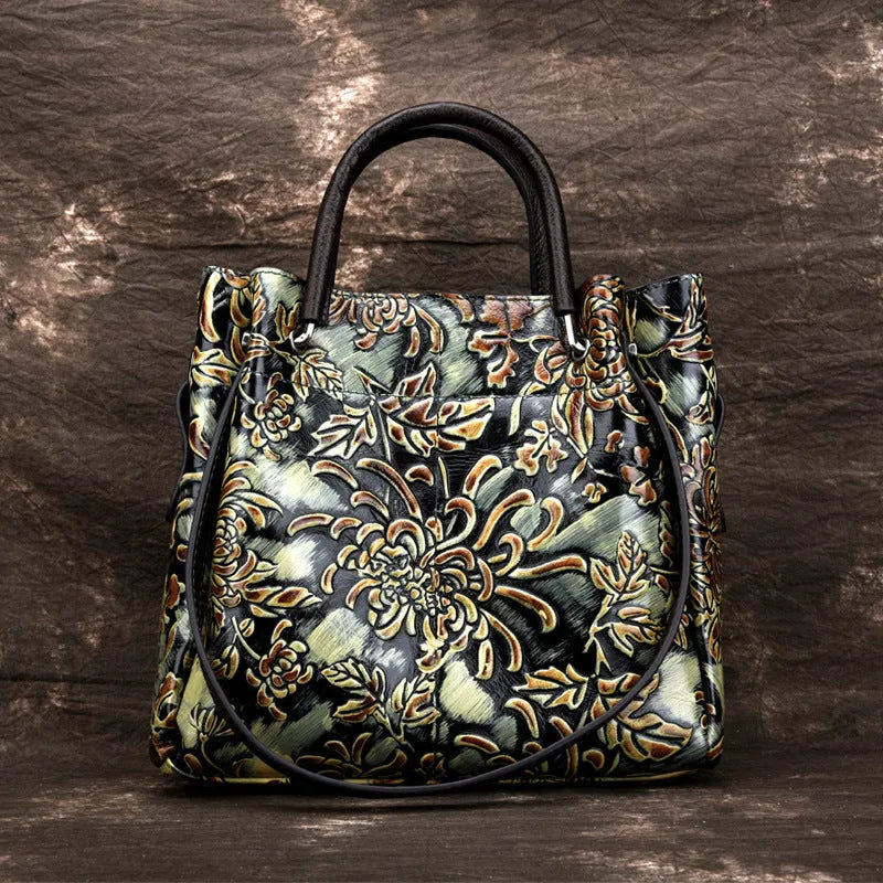 First layer cowhide women's messenger bag with embossed floral pattern, retro square shape, hard handle, and single shoulder strap in brown