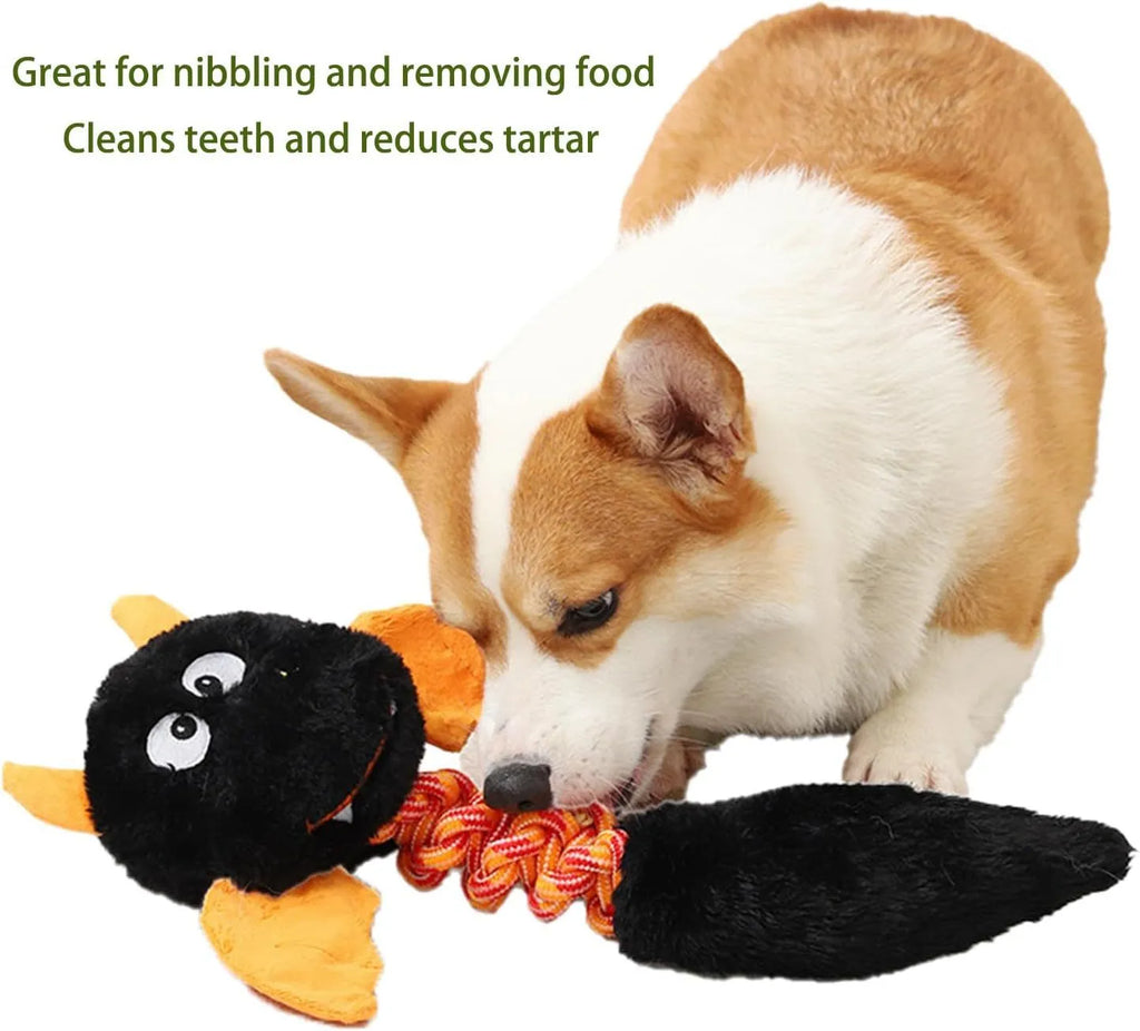 Large black plush dog toy with rope knot, shown next to a red and green version.