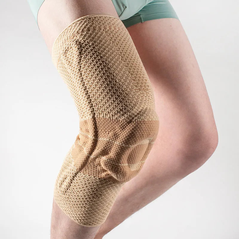 A pair of adult sports kneecaps in nylon and spandex, shown in black and blue colour, for knee protection.