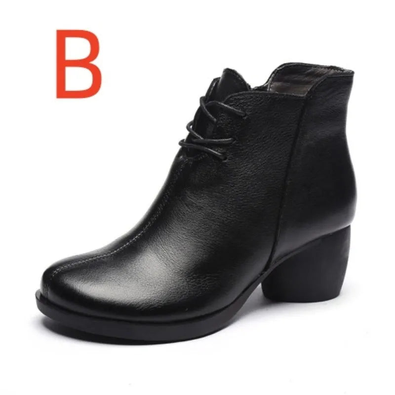 Brown women's leather Martin boots with a thick heel and round toe on a white background.