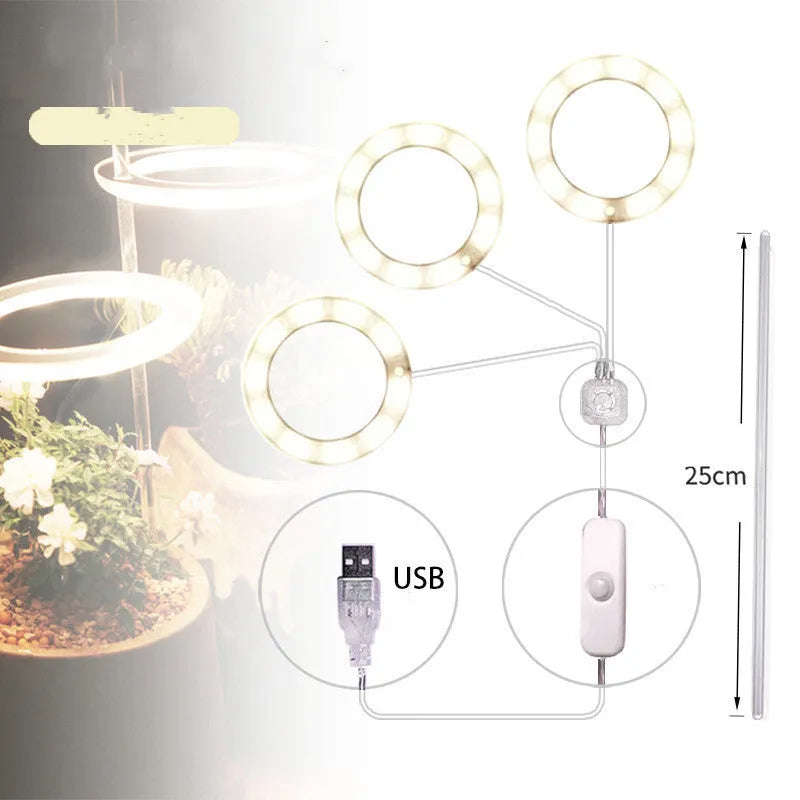 USB LED full spectrum plant grow light with acrylic stick on a table.