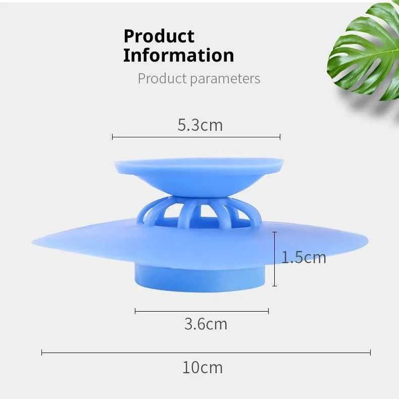 UFO-style silicone press sink drain cover in white on a modern kitchen sink