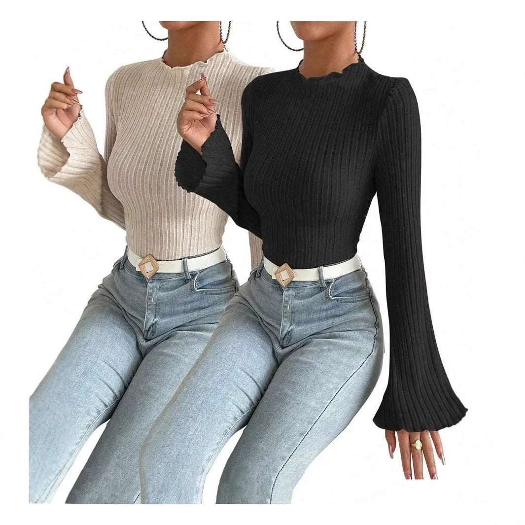 Man wearing black brushed polyester slim fit long sleeve top with sunken stripe design and round neck